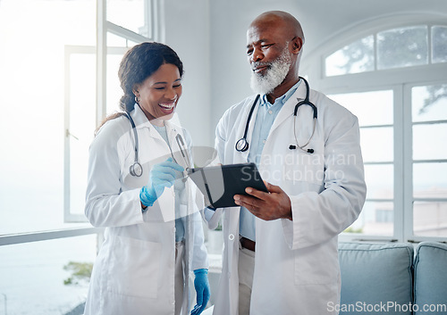 Image of African doctors, teamwork and smile with tablet, comic or conversation for team building in hospital. Senior black man, woman and medical discussion with digital touchscreen, social media and clinic