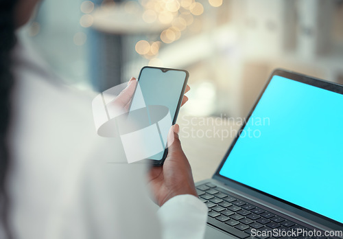 Image of Hands, laptop and phone with a doctor in the hospital, typing healthcare data for diagnosis in an office. Communication, insurance or report with a medicine professional searching medical information