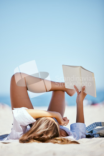 Image of Book, beach and woman reading on vacation, holiday or summer travel in nature outdoor with mockup space. Relax, novel and person at sea or ocean coast for calm, peace and freedom for break in Bali.