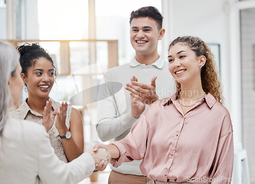 Image of Handshake, applause and business women in meeting success, celebration or boss thank you, onboarding or hiring. Clapping, mentorship and people shake hands in achievement, thanks or project promotion