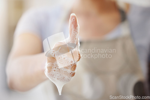 Image of Closeup, soap and person with thumbs up, foam and hygiene with healthy habits, agreement and wellness. Zoom, woman and girl with hand gesture, promotion or daily care with bacteria, clean and bubbles