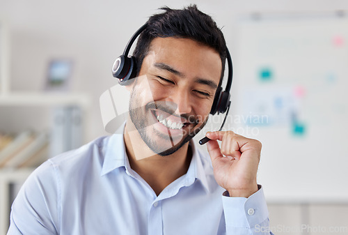 Image of Smile, call center and Asian man telemarketing, customer service or technical support. Crm, contact us and sales agent, consultant and employee working at business help desk, consulting and listening