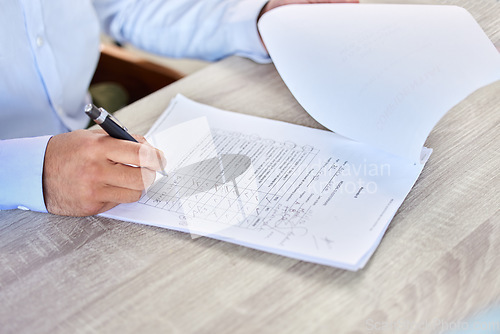 Image of Man, hands and writing on medical questionnaire, paperwork or healthcare application on desk at the clinic. Hand of male person, customer or patient rating hospital form, survey or document on table