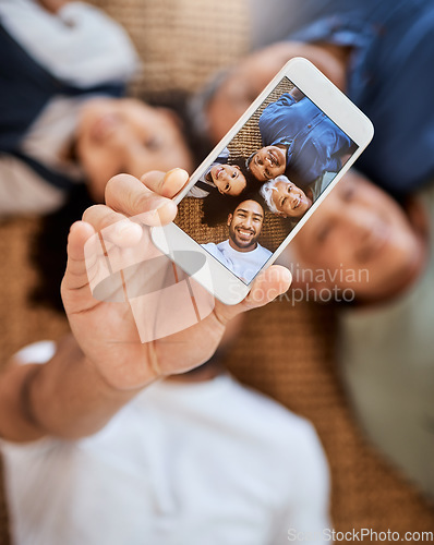 Image of Happy family, phone screen and selfie for social media, online post or vlog on floor together at home. Top view of Grandparents, father and child smile for photo, memory or profile picture in house