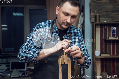 Image of Concept of handmade craft production of leather goods.