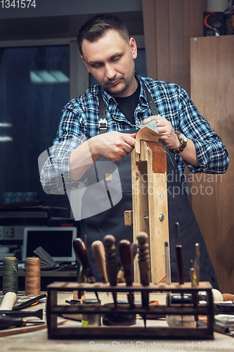 Image of Concept of handmade craft production of leather goods.