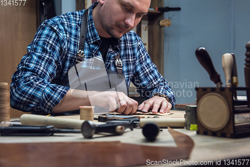 Image of Concept of handmade craft production of leather goods.