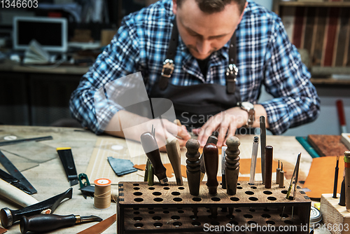 Image of Concept of handmade craft production of leather goods.