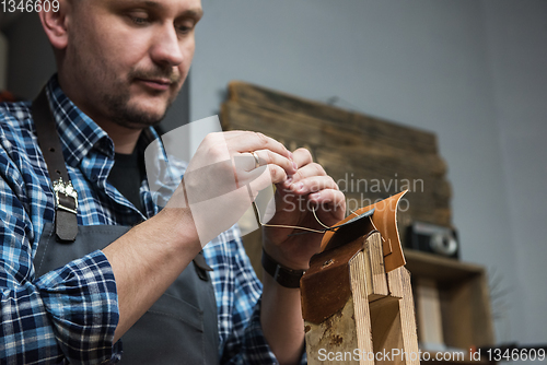 Image of Concept of handmade craft production of leather goods.