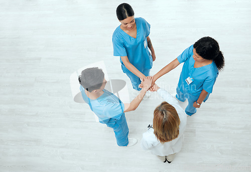 Image of Above, teamwork or hands of nurses in collaboration in meeting for healthcare, targets or goals. About us, team building or top view of medical doctors with group support, motivation or mission