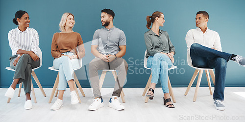 Image of Interview queue, business people and talk by wall with smile, diversity and waiting room for hr recruitment. Men, women and happy together for interview, human resources and hiring for job at startup