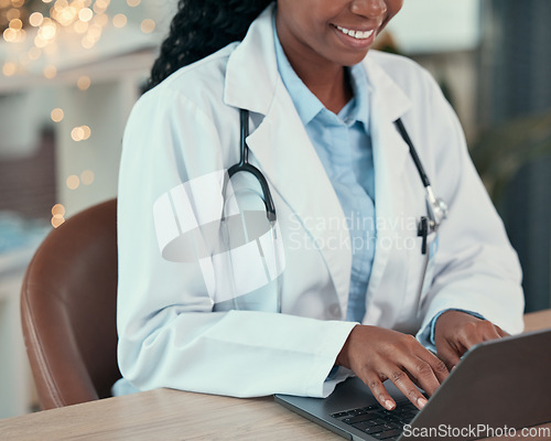 Image of Laptop, doctor and hands of woman typing for research, healthcare or telehealth in hospital. Computer, medical professional and happy person with online consultation, reading email and wellness
