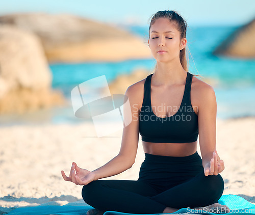 Image of Yoga, calm and meditate on the beach with zen on a mat for wellness in cape town for workout. Ocean, balance and yogi with peace with lotus in summer for fitness with mental health and freedom.