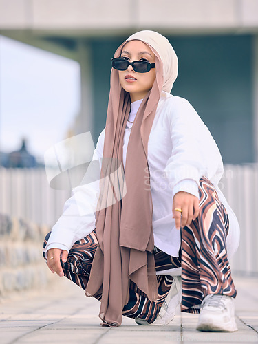 Image of Portrait, fashion or religion with a muslim woman in the uae wearing a hijab and scarf for contemporary style. Islam, faith and burka with a trendy young islam person outside in traditional clothes