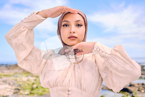 Image of Portrait, hands or fashion with an islam woman outdoor in a hijab for religion or contemporary style. Islam, faith or headscarf with a trendy young arab female person posing outside in modern clothes