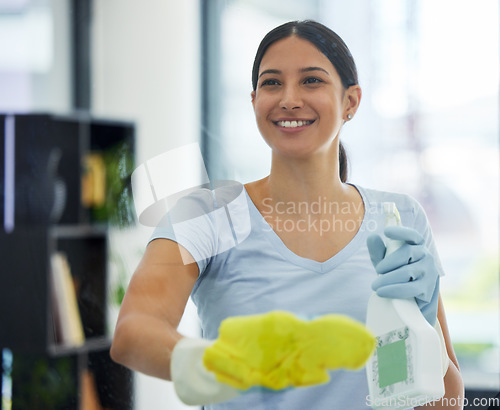 Image of Happy, woman and cleaning glass with bottle, gloves and detergent for housekeeping in home or office. Cleaner, service and female domestic cleaner with product for bacteria, dust or germ prevention