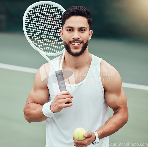 Image of Portrait of happy man with racket, tennis ball and smile, fitness mindset and confidence for game on court. Workout goals, pride and happiness, male athlete with motivation for health and wellness.