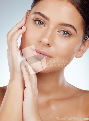 Image of Face, skincare and beauty of woman in studio isolated on a white background. Portrait, natural and serious female model in makeup, cosmetics or facial treatment for skin health, aesthetic or wellness