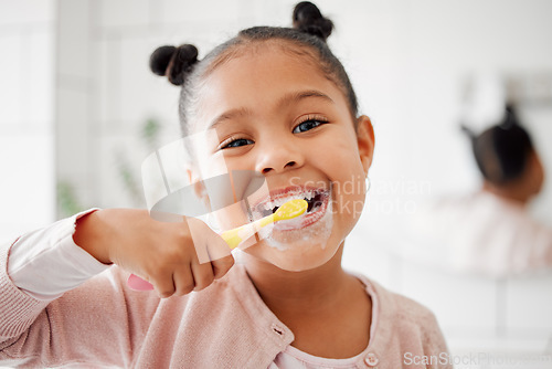 Image of Toothbrush, brushing teeth and face of a child in a home bathroom for dental health and wellness. Smile portrait of african girl kid cleaning mouth with a brush for morning routine and oral self care