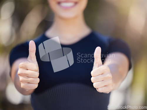 Image of Runner, hands or woman with thumbs up in park for fitness training with positive mindset or smile. Workout motivation, blur closeup or girl smiling with like sign, hand gesture or thumb up in nature