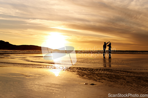 Image of Couple, sunset and dancing by ocean with space for mockup in summer sunshine with love, care and dance on holiday. Man, woman and dance with sky background, beach and clouds on romantic vacation