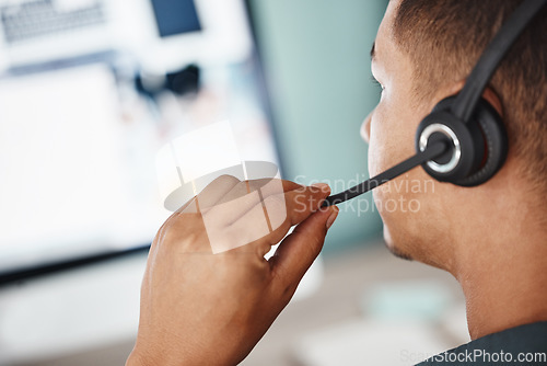 Image of Back, call center and man listening on computer for telemarketing, customer service and support. Crm, contact us and sales agent, consultant or employee working at help desk, consulting and business.