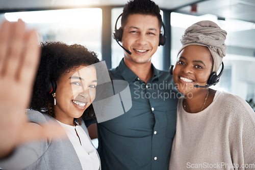 Image of Call center, selfie and happy team together for telemarketing, sales and crm work. Diversity women and a man smile for social media photo as contact us, customer service and help desk support staff