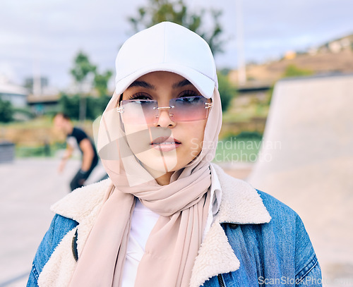 Image of Portrait, fashion or sunglasses with an arab woman outdoor in a cap and scarf for contemporary style. Islam, faith and hijab with a trendy young muslim female person posing outside in modern eyewear