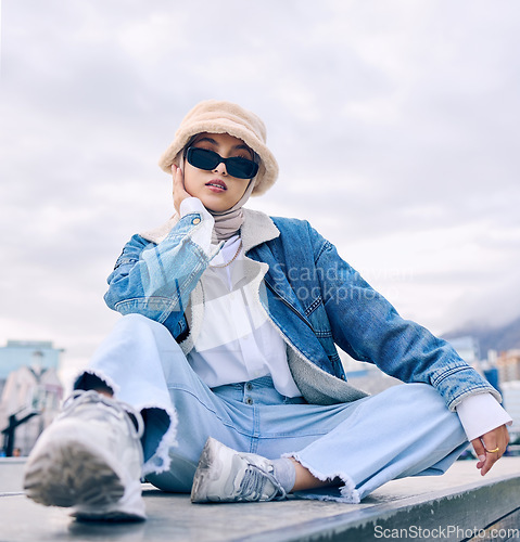 Image of Portrait, fashion and Islamic woman in a city, sunglasses and trendy with a hijab, stylish outfit or gen z. Face, Muslim female person or confident girl outdoor with casual clothes, beauty or eyewear