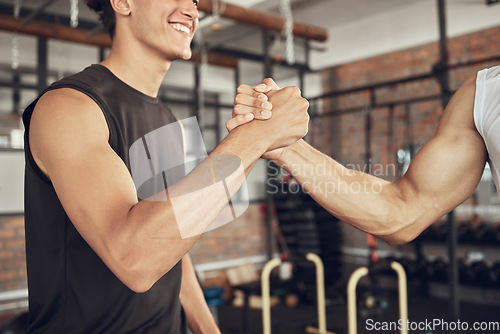 Image of Training, handshake and people at a gym for fitness, agreement and deal on blurred background. Sport, friends and men shaking hands for healthy lifestyle commitment, goal and personal trainer support