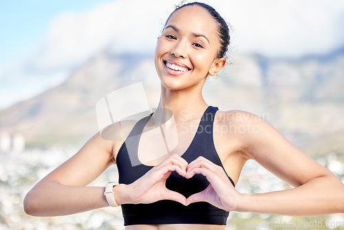 Image of Happy woman, portrait and fitness with heart hands in nature for workout, exercise or cardio training outdoors. Fit, active or sport female person, athlete or runner with loving emoji or sign outside