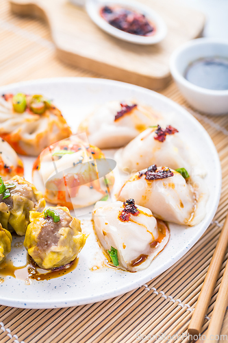 Image of Assortment of steamed dumplings Dim Sum on kitchen table