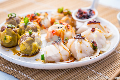 Image of Assortment of steamed dumplings Dim Sum on kitchen table