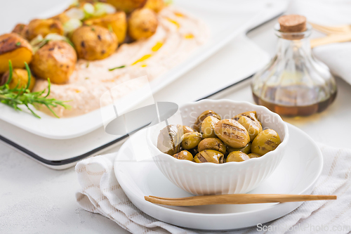 Image of Grilled olives with whipped feta, ricotta, cheese dip (Tirokafte