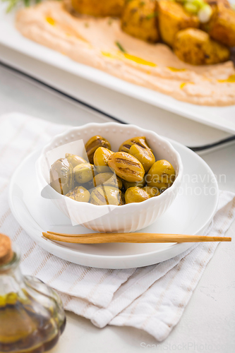 Image of Grilled olives with whipped feta, ricotta, cheese dip (Tirokafte