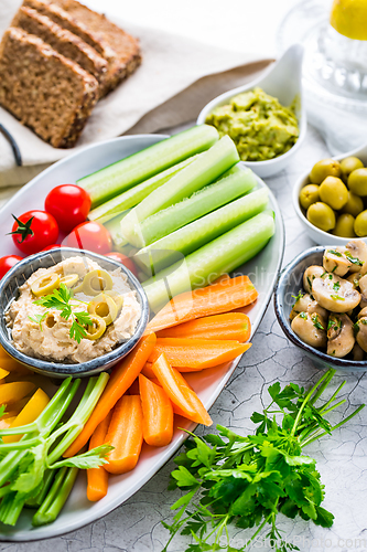 Image of Summer crudites platter with hummus and avocado dip