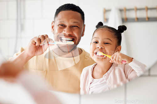 Image of Child, dad and brushing teeth in a family home bathroom for dental health and wellness in a mirror. Face of african man and girl kid learning to clean mouth with toothbrush and smile for oral hygiene