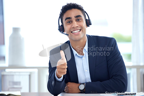 Image of Portrait, thumbs up and business man in call center office for support, trust and success. Face, like hand gesture and happy person with excellence emoji, welcome and thank you for customer service.