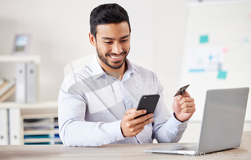 Image of Businessman, credit card and phone for payment in office with internet for online shopping subscription. Professional asian person at desk for ecommerce safety, budget app or banking information