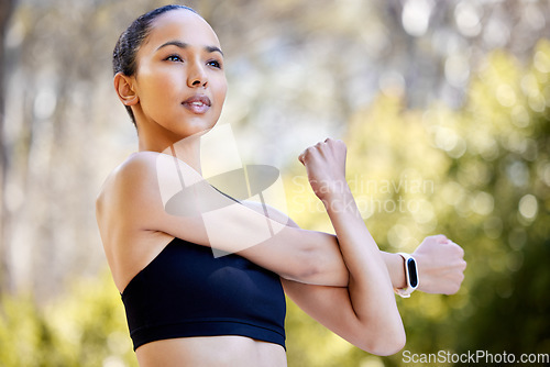 Image of Fitness, woman and stretching arms for workout, exercise or healthy cardio in the nature outdoors. Fit, active and sporty female person, athlete or runner in warm up arm stretch for training or run