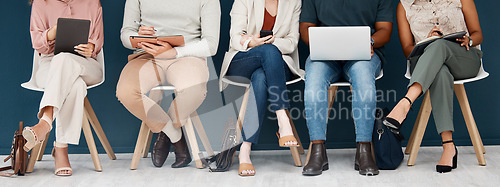 Image of Technology, diversity with group of people and sitting together. Laptop, smartphone and tablet. Social networking or media, connectivity or streaming media and colleagues with tech sit on chair