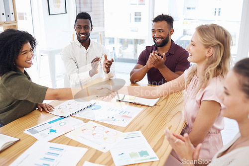 Image of Handshake, clapping and business women in meeting celebration, success or thank you for financial profit or data. Teamwork, diversity and people shake hands in collaboration, thanks and project bonus