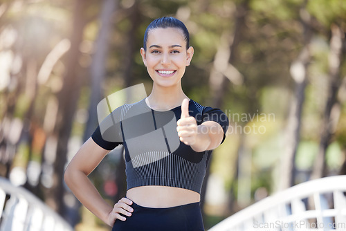 Image of Runner, portrait or happy woman with thumbs up in park for fitness training with positive mindset or smile. Motivation, workout or personal trainer with like sign, hand gesture or thumb up in nature