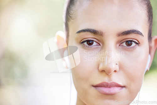 Image of Face portrait, runner or woman with earphones for music to start training, workout or running exercise in park. Serious, healthy or sports girl athlete listening to radio or podcast about fitness