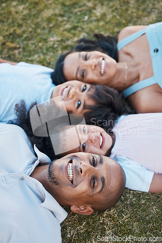 Image of Family, happy portrait and lying on grass in garden with mother, father and kids together with love. Face, top view and dad with mom and children with parent support and care on a lawn with smile