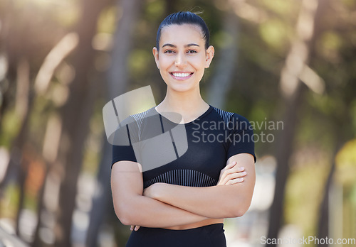 Image of Runner, portrait or happy woman in park with arms crossed ready for a workout, exercise or fitness training. Face, sports girl or female athlete with smile, positive mindset or wellness in nature
