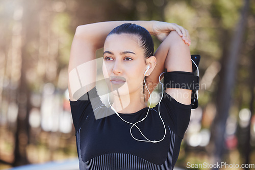 Image of Music, woman thinking or runner stretching arms for workout, body movement or relaxing on break. Podcast, radio or healthy girl athlete in fitness training warm up for flexibility or mobility in park