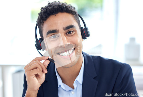 Image of Portrait, call center and business man smile in office for support, customer service or telemarketing. Face, contact us and sales agent, crm consultant and person from Brazil consulting at help desk.