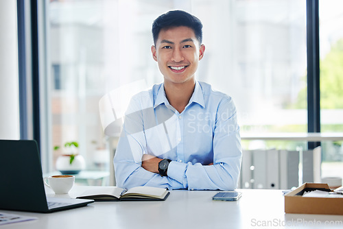 Image of Portrait, business and Asian man with arms crossed, laptop and confident consultant in a workplace, smile and career. Face, male person or employee with a pc, technology or notebook with professional