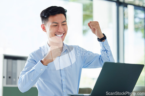 Image of Winning, computer and business man in success, yes and cheers for bonus, investment and online profit or news. Winner, professional accountant or asian person with fist, celebrate sales and laptop